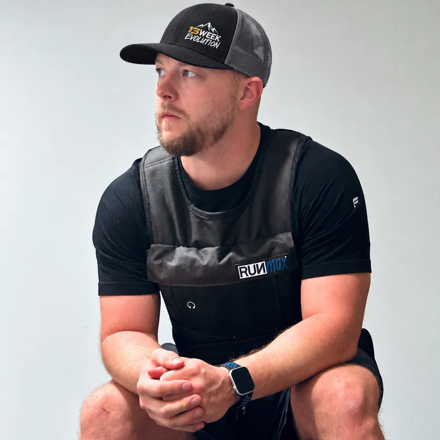 Mike Zimmer, founder of 13 Week Evolution, in a 13 Week Evolution cap and a weighted vest.
